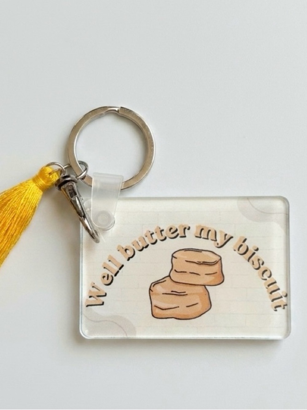 Well butter my biscuit keychain - Yellow Tassel
